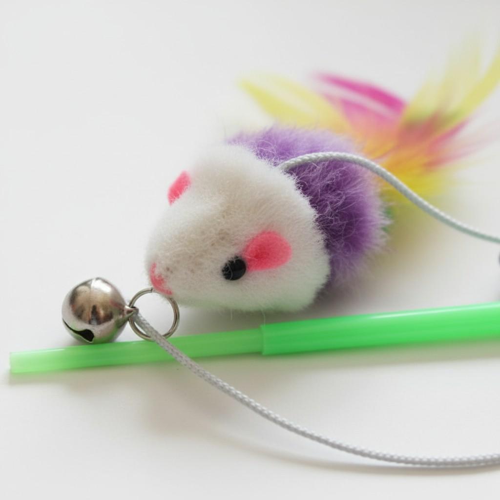 Close-up of mouse attached to cat teaser toy