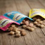 Cat treats spilling from Dreamies pack