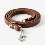 Leather dog leash shown in front view on white background