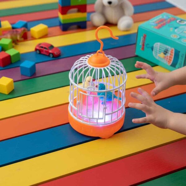 Top view of interactive bird cage toy with kid playing on table