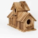 Rustic wooden bird house for outdoor birds on a white background.