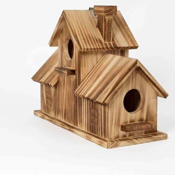 Rustic wooden bird house for outdoor birds on a white background.